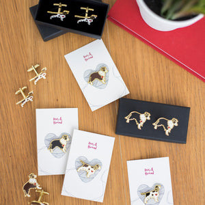 A collection of Ren and Thread&#39;s enamel cufflinks and pin badges laid out on a wooden table with their packaging. Perfect wedding day or Christmas gifts.